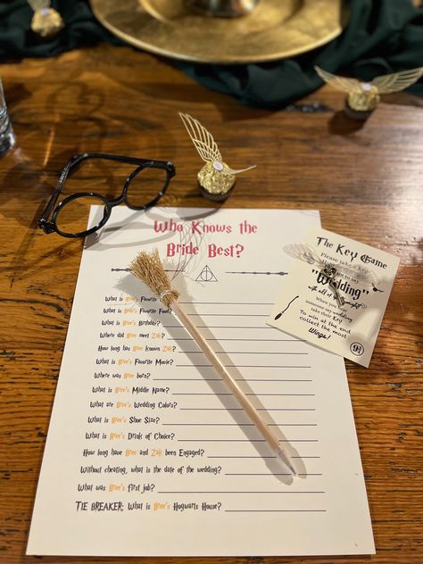 Table place setting with party games called “who knows the bride best” and “the key game” where guests have to collect the most keys from catching other people saying wedding! Harry Potter glasses, Golden Snitch ferrerro roche, flying key and broom pencil! Bachelorette Harry Potter, Harry Potter Theme Bridal Shower Ideas, Harry Potter Hen Do, Harry Potter Themed Bridal Shower Ideas, Harry Potter Party Table, Harry Potter Bridal Shower Ideas, Harry Potter Bride, Bridesmaids Duties, Harry Potter Bachelorette Party