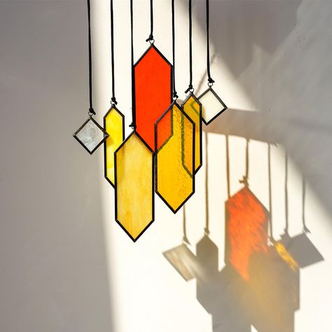 PRICES MAY VARY. Made of 100% Real Glass: Crafted with meticulous attention to detail, these stained glass panels are made with high-quality materials to ensure durability and longevity, allowing you to enjoy their beauty for years to come.Size 1.3*2in (2pcs), 1*4.3in(2pcs), 1.9*5.5in(3pcs) Unique Stained Glass Suncatcher: Each suncatchers in this 7-piece set features a captivating and artistic stained glass panel design in earth tones, adding warmth and a modern touch to any setting, creating a Stained Glass Lamp Base, Unique Window Design, Spiderweb Stained Glass Pattern, Laser Cut Suncatcher, Stained Glass Wedding Gift Ideas, Small Stained Glass Patterns, Easy Stained Glass Projects, Old Stained Glass Windows, Small Stained Glass Projects