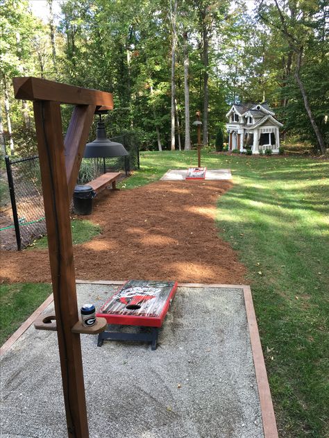 Cornhole And Horseshoe Pit, Cornhole Patio Ideas, Cornhole Horseshoe Pit, Fire Pit And Corn Hole, Cornhole Board Playing Area, Build Backyard Games, Backyard Corn Hole Court, Corn Hole Playing Area, Cornhole Area Ideas