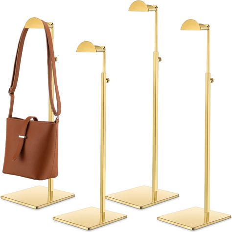 PRICES MAY VARY. Gold Stands: you will receive 4 polished gold purse display stands, it's durable, no fading gold finish that looks very textured and allows you to display or store bags you can hang at home or in the store, Looks elegant and very neat Strong and Durable: our metal hanger display stands are made of sturdy, rust free stainless steel with a thick, weighted, stable base and semi circular hooks to hang your handbags securely, you don't have to worry about his quality Adjustable Heigh Boutique Counter, Aesthetic Purse, Boutique Store Displays, Rose Gold Purse, Purse Display, Handbag Display, Store Boutique, Bag Rack, Landscape Inspiration