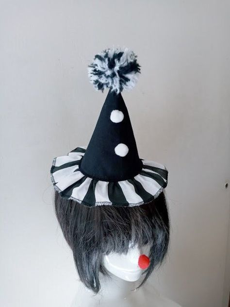 This beautiful Mini Clown hat is handmade with black twill fabric and striped black/white cotton fabric for bottom ruffle. It has 2 white pom poms trim at center front and a handmade black/white big pom pom tops it off. It has adjustable movement  from side to side . It comes on a black headband that goes to 2 elastic loops, so you can slide it into any position on your head. It is comfortable to wear. Perfect to wear in a costume party or for a cosplay. ( The headband is removable) Adult size. Cute Clown Costume, Jester Halloween, Big Pom Pom, Clown Costume Women, Clown Accessories, Clown Core, Jester Costume, Clown Hat, Clown Clothes