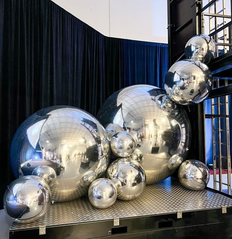 Honored to create this futuristic setup for @siemens_usa #PFE24 awards ceremony! ✨ 🚀 Our silver Spheres, lighted Marquee Letters, custom Star Arch, and a fully customized backdrop brought the perfect touch to such an important event. For us there’s nothing better than creating moments that help celebrate hard work and success.💫 #siemensenergy #technology #balloon #balloonstylist #balloondecorator #balloonartist #balloonstylists #orlandoballoons #orlandoballoons #spheres #stepandrepeat #cu... Futuristic Event Decor, Futuristic Party Decor, Award Ceremony Decorations, Silver Party Theme, Futuristic Event, Customized Backdrop, Futuristic Party, Lighted Marquee Letters, Bar Mitzva