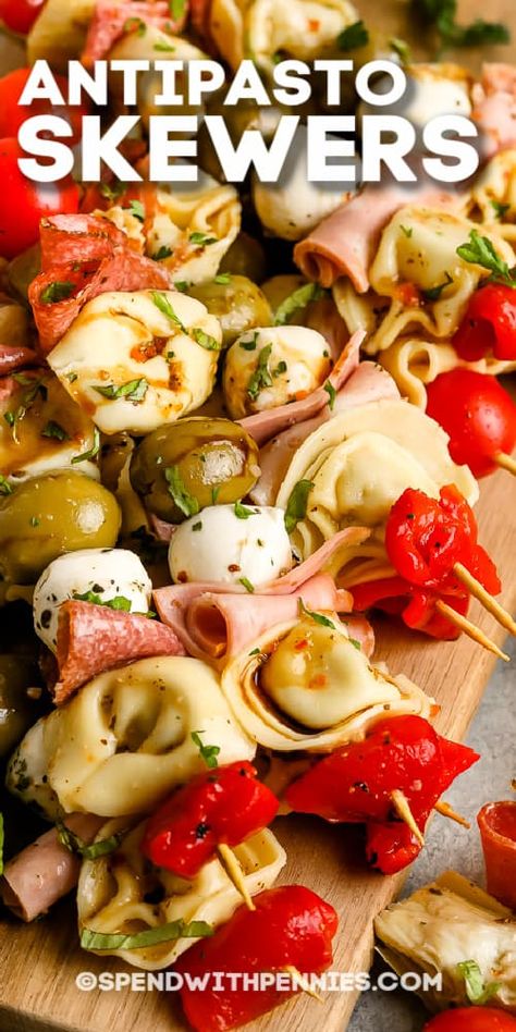 Antipasto Skewers are a fun, elegant way to serve appetizers at a party! Favorite meats, cheeses, tortellini, and olives are skewed and served with red or white wine! #spendwithpennies #antipastoskewer #recipe #appetizer #easy #italian Mini Antipasto Skewers, Food To Serve At A Party, Appetizer Recipes With Meat, Tortellini Kabobs Antipasto Skewers, Red Party Food, Tortellini Skewers, Appetizer Easy, Marinated Cheese, Italian Recipes Appetizers