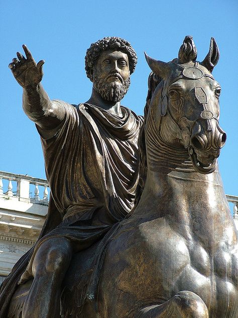 Marcus Aurelius (121 - 180 AD) was an emperor of noble character, raised by his adoptive father, Antoninus Pius (138 - 161 AD). He embraced stoicism, a system of morality based on pure reasoning. He was educated for duty, taught in Latin and Greek by the best tutors. He determined to hold the empire together against ever-increasing odds. He was diligent, heard law cases, issued imperial edicts, and defended the borders. His reign was dominated by warfare against invaders on all key frontiers. Marcus Aurelius Statue, Famous Historical Figures, Equestrian Statue, Empire Romain, Ancient Statues, Roman Emperor, Roman History, Roman Art, What Is The Difference Between