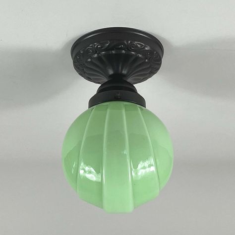 This art deco flush mount was designed and manufactured in germany in the 1920s to 1930s. It features a pale green opaline lampshade and bronzed / burnished hardware. The light requires one e26 / e27 bulb (led recommended). Diameter of canopy is 5.7" (14.5 cm). Rewired. All lighting is converted for us usage. We are unable to confirm that any electrical item meets ul-listing standards at our facility. up to 250v (europe/uk standard).the wiring of this item may be original and might need replacem Art Deco Apartment Interior, Art Deco Home Design, 1920 Home, Art Deco Ideas, Lampe Art Deco, Green Glassware, Deco Bathroom, Vintage Light Fixtures, Art Deco Home