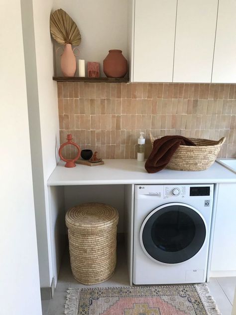 We adore the styling of this functional yet beautiful modern Mediterranean laundry. The woven laundry hamper and laundry basket work perfectly with the incredible blush pink handmade Moroccan Bejmat tile splashback. A small timber shelf adds space to style up with a few vases and vessels. Finished with a small pink rug, it's the ultimate laundry in our minds! Click the image to explore the full space. Mediterranean Laundry, Laundry Splashback Tiles, Pink Backsplash, Dog Bedroom, Coast House, Tile Splashback, Timber Shelves, Modern Mediterranean, Laundry Bathroom