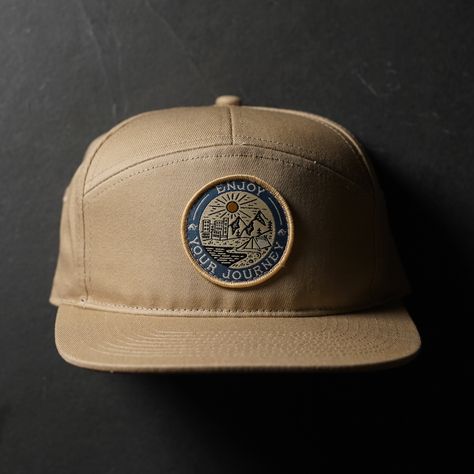 It’s like a badge you would’ve gotten in Boy Scouts but for adults. And also way cooler looking. This 5-panel hat features our badge which showcases every environment that your journey could lead. “Enjoy Your Journey” is our daily reminder to stop and appreciate the little things. We are all on our own journey, make sure to enjoy yours! Visual Clothing, Graphic Shirt Design, Hat Patch, Best Caps, 5 Panel Hat, Camo Hats, Hat Patches, Embroidered Hat, Hat Ideas