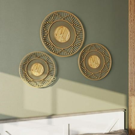 Transform your space into a bohemian haven with Layana Boho Style Farmhouse Bamboo Wall Plates. This set of three rattan and bamboo decorative plates merge earthy colors with intricate designs. Ideal for adding a touch of boho flair to any room, the woven sun pattern and earthy hues of natural jute, tan, and brown make these plates an inviting focal point. With their easy installation and versatile display options, they're a simple yet effective way to elevate your home decor. Size: 23.75" H x 23.75" W x 3.75" D. Apartment Porch Decor, Woven Wall Baskets, Woven Wall Decor, Sun Pattern, Earthy Hues, Boho Frame, Quirky Decor, Bamboo Wall, Deer Wall