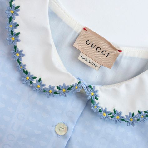 The Children's Cotton Poplin Dress by GUCCI is a delightful piece of baby clothing. Designed with quality and style in mind, this dress features soft and breathable cotton poplin fabric, making it perfect for your little one. Light blue Guccily cotton poplin jacquard Embroidered flower trim Peter Pan collar Short sleeves Button closure Made in Italy 100% Cotton Product Code: O-CC-DR-GU05 Delivery and Returns Embroidery On Blue Fabric, Embroided Collar, Blue Baby Clothes, Baby Dress Embroidery, Kids Garments, Cotton Poplin Dress, Designer Baby Clothes, Dress With Buttons, Designer Kids