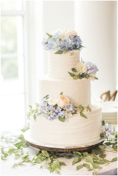 Summer Wedding Elegant cake with blue Hydrangea detail #weddingdetails #weddingphotography Wedding Cakes Hydrangea Blue, Wedding Cake Blue Hydrangea, Blue Wine Glasses Table Setting, White Wedding Cake With Dusty Blue Flowers, Wedding Cake With Hydrangeas And Roses, Dusty Blue Simple Wedding Cake, Cakes With Hydrangea Flowers, Wedding Cakes With Hydrangeas, Wedding Cakes With Frosting Flowers