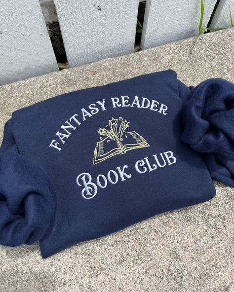 Fantasy book club Embroidered sweatshirt Book lover fashion Reader club apparel Fantasy-themed clothing Bookworm fashion Literary sweatshirt design Fantasy book enthusiast Reading community fashion Book club merchandise Novel-inspired fashion Reader lifestyle apparel Fantasy bookworm style Literary Sweatshirt, Embroidery Seasons, Book Club Outfit, Bookworm Fashion, Book Sweatshirts, Bookish Apparel, Bookworm Style, Bookish Clothing, Book Merchandise