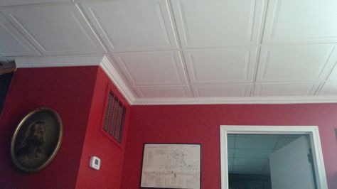 Drop ceiling blues? Try these smooth panels, that resemble a paneled ceiling. Then add crown molding, caulk and you have a look that is a whole lot easier to live with. Crown Molding Drop Ceiling, Paneled Ceiling, Drop Ceiling, Dropped Ceiling, Basement Remodel, Basement Bar, Wall Molding, Crown Molding, Basement Remodeling