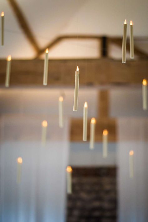 Image shows a Harry Potter themed wedding with hanging candles throughout the ceiling at Farbridge Barns. Photo credit Lucy Davis Photography Floating Candles Wedding Harry Potter, Harry Potter Candle Holder, Halloween Decor Hanging From Ceiling, Candle Hanging From Ceiling, Ceiling Floating Candles, Floating Candle Harry Potter, Hanging Floating Candles, Hanging Candles From Ceiling, Harry Potter Lights From Ceiling