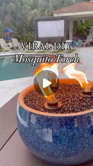 Jennifer Amarteifio | DIY Home | Faith | Lifestyle on Instagram: "Super easy and beginner friendly DIY project that keeps those pesky mosquitos away and also elevates your outdoor space! I made this last summer and it’s still holding up and works very well! 

I purchased all my supplies from @walmart for under $50. You can find all items on my Walmart storefront 🔗 in bio. 
+ planter
+ 3 torch canisters
+ bottle of tiki torch fuel + sand
+ aquarium gravel

#diytabletorch #mosquitorepellant #mosquitohack #diyoutdoorprojects #summerdiy #summerprojects #womenwhodiy #tabletopfirepit #diydecor #diyhomeprojects #diyideas #walmartcreator #walmartpartner #tikitorch
#tabletoptikitorch" Deck Tiki Torch Ideas, Diy Bug Repellent Torches, Mosquito Repellent Candles Diy, Citronella Candles Diy Outdoor Parties, Diy Mosquito Repellent Tiki Torches, Outdoor Tiki Torch Ideas, Tiki Torch Planter Diy, Diy Tiki Torch Fire Bowl, Tiki Torch Ideas Backyards