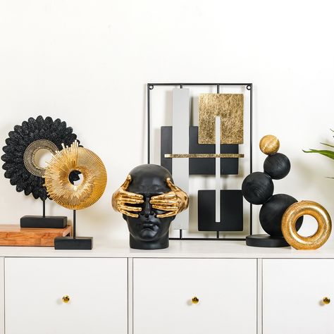 These showpieces are the next showstopper of your home’s decor arena🎭 Take your pick!😄 Products Included: 1. Sparkle Feather Sculpture Black And Gold 2. Stacked Modern Sphere Sculpture Black And Gold 3. Art Face Showpiece Black And Gold 4. Gold Donut Showpiece Vase 5. Contemporary Art Design Metal Wall Decor 23x15 Inch 6. Abstract Ammonite Showpiece For Home Decor 7. Celestial Modern Decor Candle Holder Showpiece 8. Abstract Gold Sitting Figurine With Crystal Ball 9. Abstract Twisted Decor... Feather Sculpture, Showpiece For Home Decor, Sphere Sculpture, Nest Decor, Gold Donuts, Contemporary Art Design, Art Face, Unique Home Decor, Face Art