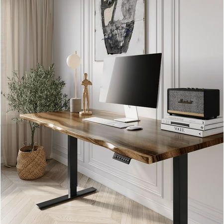 "Introducing UMBUZO's Express Ship Stand-Up Desk - Elevate Your Workspace in Just 1 Day! Transform your office with the UMBUZO Sit-Stand Desk  the epitome of sophistication for the dedicated professional. Meticulously crafted with a luxurious solid walnut surface and a precision motorized frame, this desk seamlessly marries elegance with dynamic functionality. Indulge in the unparalleled value of our standing desk  a premium investment in both comfort and productivity, all at an unmatched price.  Lifetime Quality Assurance  Sustainably Sourced Wood  Proudly US-Based Every piece possesses unique characteristics, ensuring an individualized, hand-finished furniture item that stands apart from mass-produced alternatives. For the first 100 units sold, enjoy an exclusive 70% discount on this mas Stand Up Office Desk Ideas, Standing Desk In Bedroom, Office With Standing Desk, Office Desk Essentials, Standing Desk Ideas, Professor Office, Standing Desk Setup, Walnut Office Desk, Standing Desk Home Office