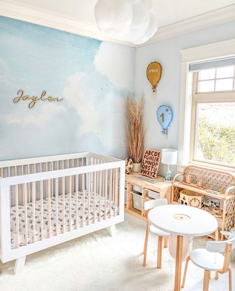 New on the blog! ☁️ A cloud nursery is a classic nursery theme, and we are loving this elevated take. The cloud wall mural shines and is the perfect backdrop for that show-stopping cloud light fixture. Head to stories to see more. 📸: @dmak.xo Sun And Sky Nursery, Cloud Light Nursery, Blue Sky Nursery, Fun Nursery Ideas, Sky Themed Nursery, Cloud Theme Nursery, Neutral Nursery Themes, Cloud Nursery Theme, Unique Nursery Ideas