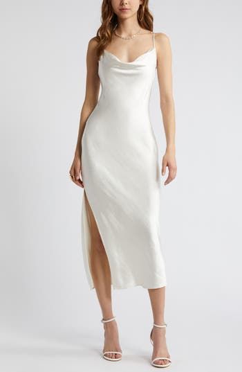 Effortless to style up or down, this gracefully draped satin slipdress belongs in your wear-on-repeat collection. 26 1/2" to 46" center front length (size Medium) Cowl neck Adjustable straps Unlined 100% polyester Machine wash, tumble dry Imported Cowl Neck Reception Dress, Cowl Neck Dress White, White Cowl Neck Dress, White Silk Slip Dress, Cowl Neck Wedding Dress, Silk White Dress, White Satin Slip Dress, Ivory Silk Dress, Graduation Dress White