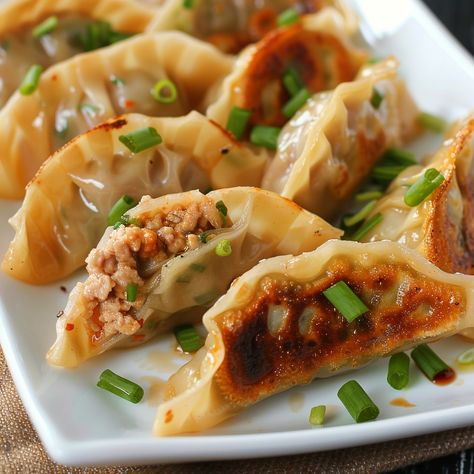 🍜 Dive into delicious Mandu, Korean dumplings! 🥟✨ #ManduMagic #KoreanDumplings Mandu (Korean Dumplings) Ingredients: Ground pork (1 lb) Green onions, finely chopped (1 cup) Garlic, minced (2 cloves) Soy sauce (2 tbsp) Sesame oil (1 tbsp) Ginger, grated (1 tbsp) Dumpling wrappers (1 package) Water (for sealing) Instructions: In a bowl, mix ground pork, green onions, garlic, soy sauce, sesame oil, and ginger. Place a teaspoon of filling in the center of a dumpling wrapper. Moisten edges wit... Korean Mandu, Mandu Korean, Korean Dumplings, Dumpling Wrapper, Instagram Recipes, Dumpling Wrappers, Trending Recipes, Ground Pork, Sesame Oil