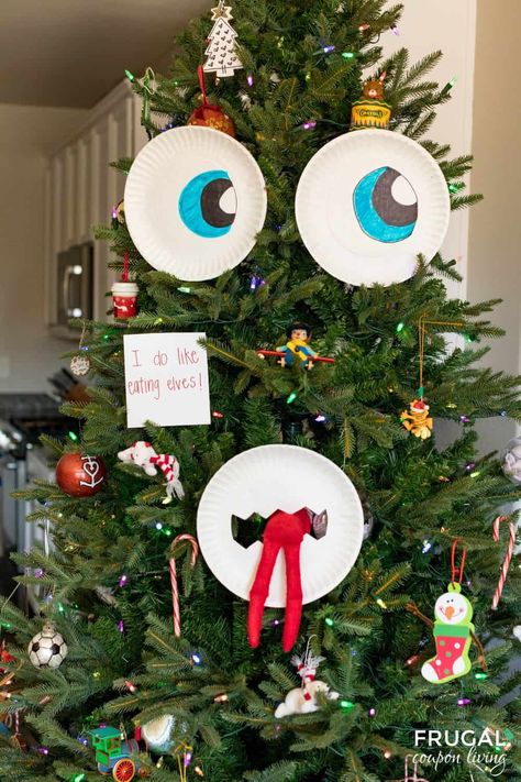 Use paper plates and make a DIY Christmas Tree Face when you create this fun Christmas Tree Monster Eating Elf on the Shelf idea. New Elf on a Shelf Ideas daily plus fun elf printables. Christmas Tree Elf Ideas, Elf On The Shelf Ideas With Christmas Tree, Elf On The Shelf On Christmas Tree, Elf On The Shelf Ideas Tree, Elf On Christmas Tree, Elf In Christmas Tree, Christmas Tree Elf On The Shelf, Elf Tree Ideas, Elf On The Shelf Little Debbie Trees