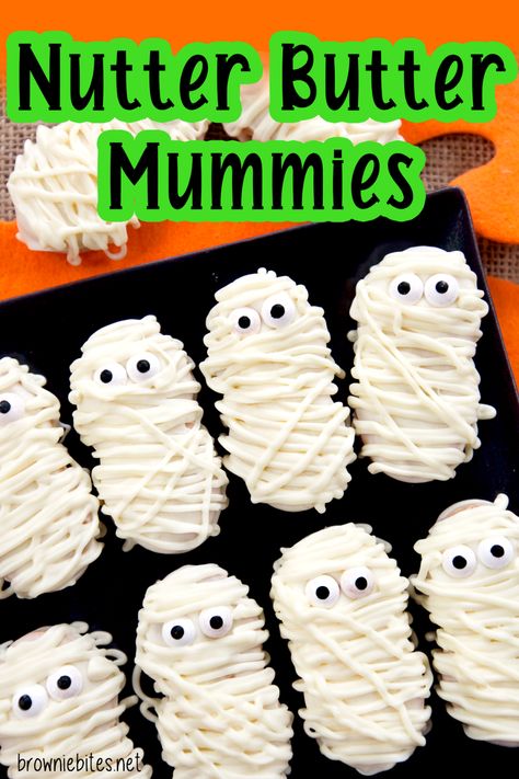 recipe for no bake nutter butter mummy cookies for halloween Nutter Butter Cookies Ideas, Nutter Butter Dipped In Chocolate, Butter Butter Mummies, Halloween Sweet Treats For Kids School, Recipes Using Nutter Butter Cookies, Halloween Nutter Butter, Nutter Butter Mummies, Nutter Butter Mummy Cookies, Nutter Butter Halloween Cookies