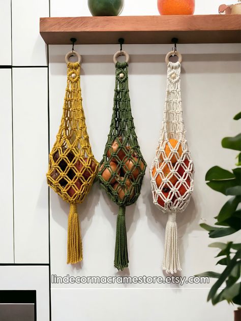 Thanks so much for visiting our store, we make macrame products in various colors, sizes, styles, all 100% natural materials, pure soft cotton cords with clean color and no bad smell at all ^^ Macrame Hanging Fruit Basket perfect for softing and organizing produce, vegetables, fruits in style boho. Bag handmade storage unit is designed to hang in your kitchen or pantry, maximizing space and keeping your produce fresh and easily accessible. Say goodbye to countertop clutter and hello to a more or Macrame Kitchen Ideas, Macrame Fruit Hanger Diy, Fruit Basket Ideas Kitchen, Hanging Macrame Basket, Fruit Storage Ideas, Hanging Fruit Hammock, Macrame Hanging Fruit Basket, Macrame Fruit Basket, Practical Macrame