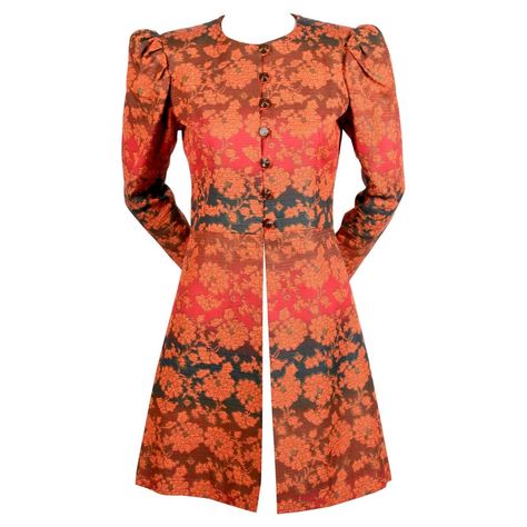 Vivid gradient colored floral coat with puff sleeves from Yves Saint Laurent dating to the 1960. Coat best fits a US size 2 or 4. Approximate measurements: shoulder 14", bust 35", empire waist 30", arm length 23", underarm to cuff 16.5" and overall length 34". Fabric is a sturdy cotton twill blend. Fully lined. Brown button closure. Metal zippers at wrists. Made in France. Excellent condition. Blouse Batik Kerja, Astrakhan Coat, Batik Blazer, Quilted Jacket Pattern, Batik Kombinasi, Floral Coat, Black Velvet Jacket, Casual Blazer Women, Designer Coats