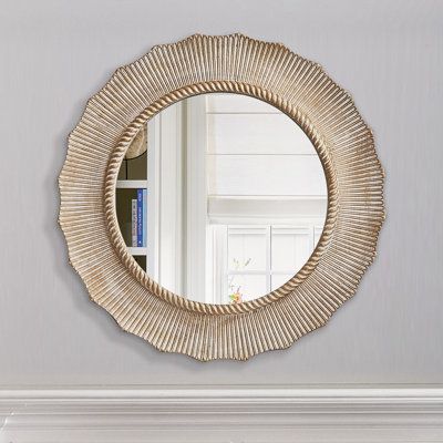 This sunflower-inspired wall mirror adds an elegant look to your space with its scalloped edges and textured designs. The round mirror is crafted with a wooden frame, and it features a natural, weathered finish that complements various decor styles from coastal to boho. Ideal for damp and dry locations, this versatile accent mirror can be mounted horizontally or vertically to suit your preference. Its classic frame design brings timeless appeal to your living room, bedroom, or entryway. We also Entryway Mirror Inspiration, Navy Mirror, Autumn Centerpieces, Round Wood Mirror, Coastal Mirrors, Decorative Wall Mirrors, Coastal Entryway, Wall Decorating Ideas, Horizontal Mirrors