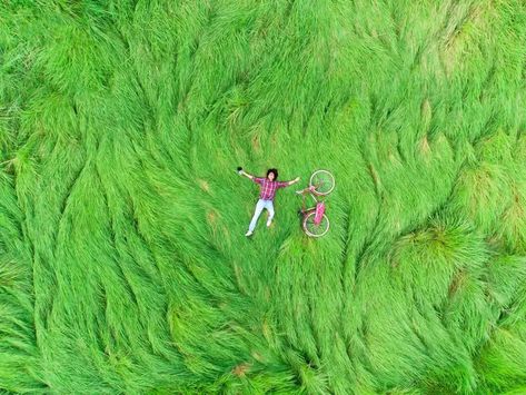 A Person Lying In A Field Of Grass With Bicycle#pikbest##Photo Person Lying Down Reference, Lying In A Field, Bicycle Photo, Grass Drawing, Foto Inspo, Merch Ideas, Landscape Concept, Grass Field, Landscape Drawings