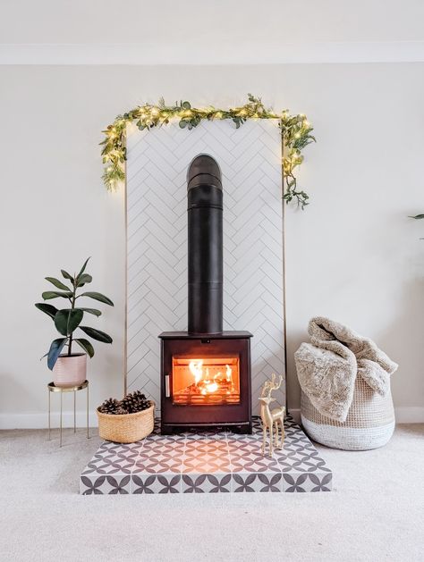 How to create a surround for a wood stove burner with no chimney. Living room flat wall made to look like the stove has always belonged Tile Chimney, Herringbone Tile Wall, Tiled Hearth, Stove Surround, Wood Stove Surround, Wall In Living Room, Wood Burner Stove, Stove Ideas, 60s House