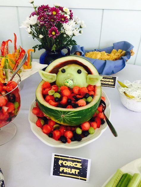 Baby Yoda fruit bowl for a Star Wars baby shower Yoda Fruit Bowl, Baby Fruit Bowl, Star Wars Watermelon, Grogu Party Food, Star Wars Fruit Ideas, Star Wars Themed Gender Reveal Party, Star Wars Themed Party Food, Star Wars Tablescape, Baby Jedi Baby Shower Ideas