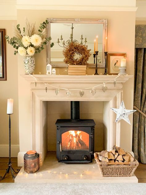 White fireplace with flowers on the mantle Cottagecore Mantle Decor, Cottage Core Mantle, Cream Fireplace Living Room, Small Fireplace Mantle Decor, Small Sitting Room With Fireplace, Cottage Fireplace Decor, Cottage Mantle Decor, Cottagecore Mantle, White Fireplace Decor