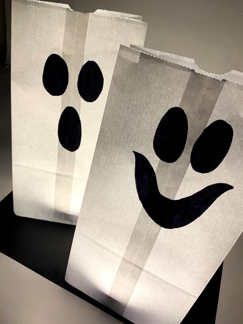 Halloween is just around the corner and that means it's time to start thinking about what decorations you want to put up. Paper bag ghost luminaries are a great option because they're easy to make and they look really spooky. Plus, they're perfect for both indoor and outdoor use. So if you're looking for something different this year, then check out these instructions on how to make your own paper bag ghost luminaries. You won't be disappointed! Decorating Paper Bags For Halloween, Paper Bag Illuminaries Diy, Paper Bag Ghost Craft, Halloween Paper Bag Treat Bags, Halloween Paper Bag Decorating Ideas, Halloween Brown Paper Bag, Paper Bag Halloween Crafts, Paper Bag Ghost, Ghost Luminaries