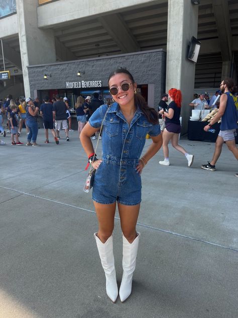 Denim Outfits For Concert, Tall White Cowboy Boots Outfit Concert, Country Concert Outfit Tall White Boots, Country Music Concert Outfit White Boots, Cowboy Boot Gameday Outfit, Denim Romper Cowboy Boots, Romper With Cowboy Boots Outfit, Jean Romper With Cowboy Boots, Gameday Outfit With Cowboy Boots