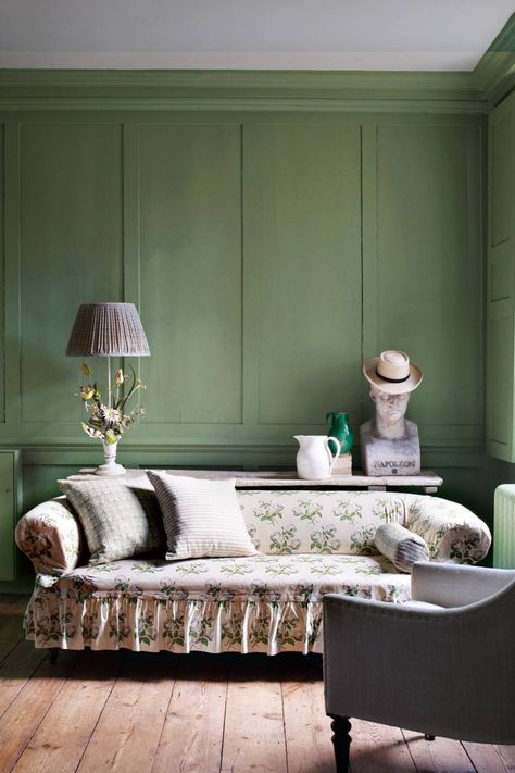 This country-style living room styled by Gabby Deeming has panelled walls painted Farrow & Ball's 'Breakfast Room Green', a soft olive. An antique sofa has been covered with a loose cover in Colefax & Fowler's legendary Bowood chintz. A trestle table displays an interesting collection of antiques including a vintage tole flower lamp and bust of Napoleon. Paint colour ideas | House & Garden Room Green Walls, Breakfast Room Green, English Country House Style, Country Style Living Room, Style Anglais, Paint Your House, Room Green, English Country Decor, Room Wall Painting