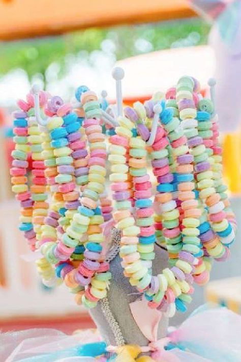 Another fun party favor for a rainbow birthday are some colorful candy bracelets. Place some on your dessert table or even your gift table so your guests can just grab one to wear.See more party ideas and share yours at CatchMyparty.com Rainbow Fourth Birthday Party, Flowers And Rainbows Birthday, Groovy Unicorn Party, Pastel Rainbow Centerpiece Ideas Diy, Rainbow Two Year Old Party, Pink Rainbow Party Ideas, Rainbow Slumber Party, Rainbow Carnival Party, Rainbow Outdoor Party