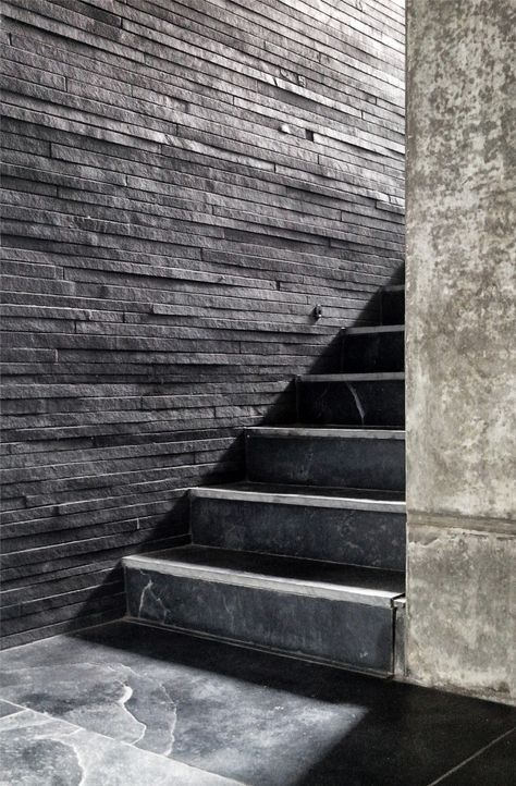 The House Cast in Liquid Stone by SPASM Design Architects. Layered slices of stone to create a wall cladding House Cast, Detail Arsitektur, Stair Wall, Beton Design, Staircase Wall, Stone Architecture, Stone Cladding, Black And White Photograph, Interior Stairs