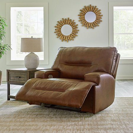 Master statement-making contemporary comfort with this power reclining sofa. It displays a striking yet streamlined profile, with auburn-hued leather match upholstery balancing natural beauty and refined design. Adjustable headrests and usb charging polish off this richly crafted piece. Signature design by Ashley is a registered trademark of Ashley furniture industries, inc.Spring Type: SinuousIncluded: 1 Recliner(s)Features: Upholstered, Power Recline, Reclining, Cushioned, Motion, Usb PortArm Brown Leather Recliner, Brown Recliner, Loveseat Recliners, Multipurpose Room, Power Reclining Sofa, Leather Recliner, Power Recliners, Ashley Furniture, Reclining Sofa