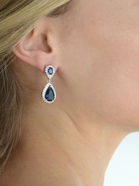 "Luxurious Sapphire Blue Cubic Zirconia Teardrop Earrings; Deep Royal Pear-Shaped CZ Halo Drop with Oval-Cut Tops; Measures 1 1/4 Inches High. Ideal September Birthstone Birthday Gift or \"Something Blue\" Wedding Accessory Top Quality AAAAA Grade Cubic Zirconia for Diamond-like Brilliance; Genuine Silver Platinum Plating with the Look of Fine Jewelry; Post Earrings with Comfort Disk Backs Beautifully Packaged in Luxurious Silver Embossed Mariell Signature Gift Box Ideal for Bridal, Wedding, Pro Bridesmaids Earrings, Formal Earrings, Silver Jewellery Online, Blue Bridal, Cz Pendant, Cz Jewelry, Silver Jewelry Handmade, September Birthstone, Sapphire Earrings