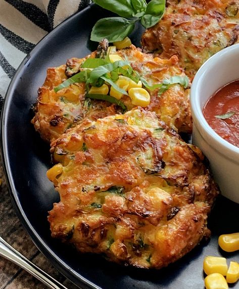 Cheesy Air Fryer Zucchini Corn Fritters (with skillet option!) - shredded zucchini, sweet corn and cheddar cheese air fried to crisp. Easy, delicious snack, lunch or side dish.  #airfryerzucchinifritters #airfryer recipes #airfryer #zucchini #zucchinirecipes #zucchinicornfritters #easyairfryerrecipes #agoudalife Airfryer Zucchini, Shredded Zucchini Recipes, Recipes Airfryer, Zucchini Cheddar, Zucchini Corn Fritters, Air Fryer Zucchini, Veggie Fritters, Corn Fritter Recipes, Zucchini Cheese