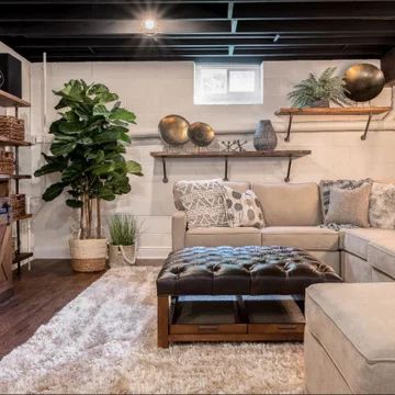 Finished Basement Tv Area, Urban Industrial Basement, Finished Basement Furniture Ideas, Simple Basement Remodel Budget, Easy Basement Renovation, Basement Boho Decor, Relaxing Basement Ideas, Short Basement Ideas, Basement Bedroom Living Room Combo