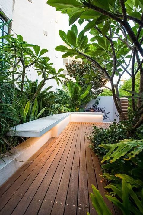 a beautiful minimalist deck with a built in bench, potted greenery, trees and plants, with built in lights is amazing Tropical Garden Design, Courtyard Gardens Design, Balkon Design, Minimalism Lifestyle, Desain Lanskap, Garden Wallpaper, Diy Garden Furniture, Garden Architecture, Outdoor Gardens Design