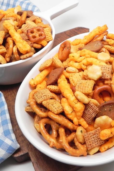 No-Bake Snack Mix | "This is my mom's no-bake snack mix recipe, and it's so much better than the normal snack mix recipes out there. It's tangy, spicy, and insanely addicting!" #footballrecipes #gamedayrecipes #tailgatingrecipes #superbowlrecipes #superbowlparty #superbowlpartyideas Snack Mix No Bake, Easy Chex Mix Recipes No Bake, Easy Snack Mix Recipes No Bake, Snack Mix Recipes No Bake, No Bake Chex Mix Recipes, No Bake Snack Mix Recipes, Toddler Snack Mix Ideas, Cracker Mix Recipes, Snack Mix Recipes Savory