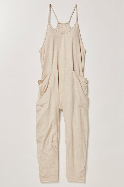 This soft and comfy onesie features a slouchy, relaxed-fitting design with a dropped crotch and convenient side pockets. **Fit:** Effortless and oversized silhouette. Meant to be loose for layering. **Features:** Racerback silhouette, oversized patch pockets, dropped armholes **Why We | Hot Shot Onesie by FP Movement at Free People, Oatmeal Heather, XL Free People Romper Jumpsuits, Free People Clothes, Free People Onsie, Free People Jumpsuit Outfit, Free People Onesie, Free People Overall, Free People Jumper, Free People Hot Shot Onesie, Light Grey Leggings