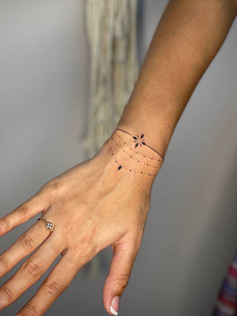 Wrist Cuff Tattoos For Women, Tattoo Bracelet Wrist, Wrist Bracelet Tattoos For Women, Wrist Tattoo Ideas Female, Bracelet Tattoos For Women, Wrap Around Wrist Tattoos, Wrist Bracelet Tattoo, Tiny Wrist Tattoos, Band Tattoos