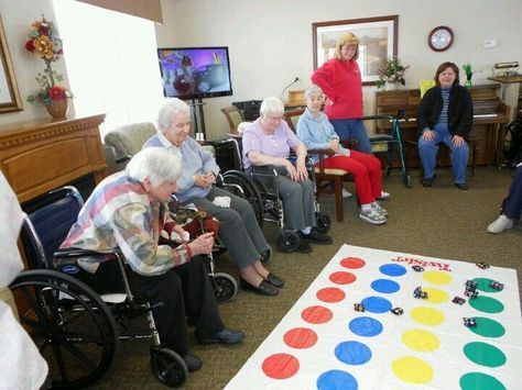 Beanbag Twister Toss. Have residents spin to determine the color the beanbag toss must land on. There are variations of this game. Can have circles identifying random objects or places of interest. The residents attempt to get the correct answer by landing near or on the correct circle.   Credit: https://www.pinterest.com/pin/50243352066136314/  the pin feature failed to locate thru the URL. Fun Activities For Seniors, Assisted Living Activities, Memory Care Activities, Senior Living Activities, Preschool Craft Activities, Activities For Seniors, Nursing Home Activities, Therapeutic Recreation, Alzheimers Activities