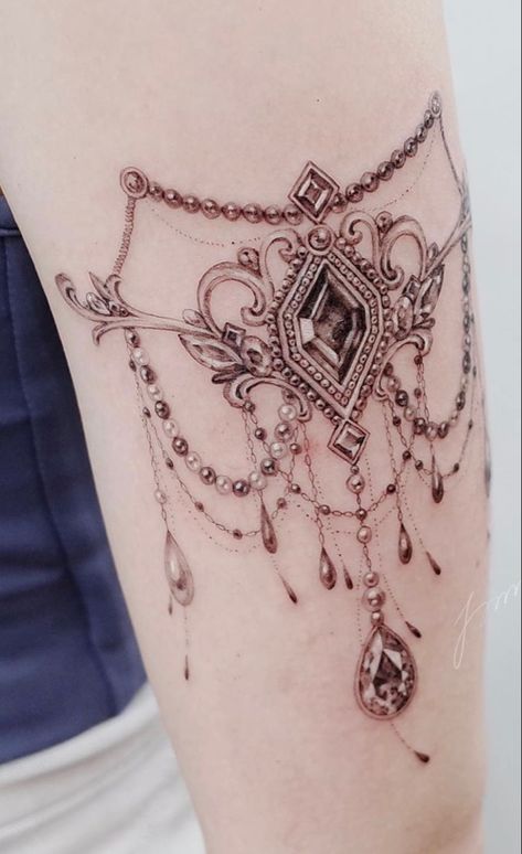 Back Jewelry Tattoo, Thigh Jewelry Tattoo, Tattoos That Look Like Jewelry, Black And Gray Jewel Tattoo, Jewelry Tattoo Designs Arm, Chandelier Tattoos For Women Arm, Vintage Jewelry Tattoo, Necklace Tattoos Women, Shoulder Jewelry Tattoo