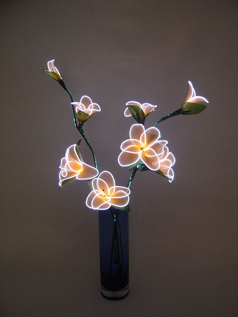 Electroluminescent wire - maybe combine this with flowers made from plastic bottles. Stick Costume, Flower Aesthetic Wallpaper, Diy Glow, Neon Flowers, Deco Studio, Outdoor Garden Lighting, Glow Stick, All Of The Lights, Neon Aesthetic