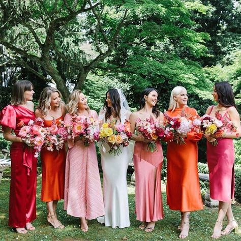 coral wedding attire, bride and bridesmaids , coral mix and match bridesmaid dresses Primary Color Bridesmaid Dresses, Blue Bridesmaid Dress With Orange Flowers, Bridesmaid Dresses Non Matching, Wedding Day Color Schemes, Bright Mixed Bridesmaid Dresses, Bright Different Color Bridesmaid Dresses, Retro Wedding Bridesmaid Dress, Mis Match Bridesmaids, Coral Mismatched Bridesmaid Dresses