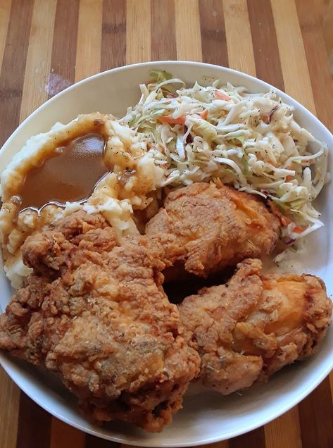 FacebookPinEmail Southern Supper Bliss: Fried Chicken, Mash, and Coleslaw What a delightful evening! 2 crispy fried chicken legs and 1 juicy thigh!! Mash Potato with Gravy! And don’t forget some coleslaw!   Southern Supper Bliss: Fried Chicken, Mash, and Coleslaw recipe Ingredients: 3 chicken pieces One egg 1 tablespoon of hot sauce Half a teaspoon... Dolly Parton Fried Chicken, Chicken Mash, Fried Chicken Dinner, Apple Dumpling Recipe, Fried Chicken Legs, Mash Potato, Buttered Vegetables, Comfort Food Chicken, Chicken Leg Recipes